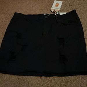 Distressed black denim skirt